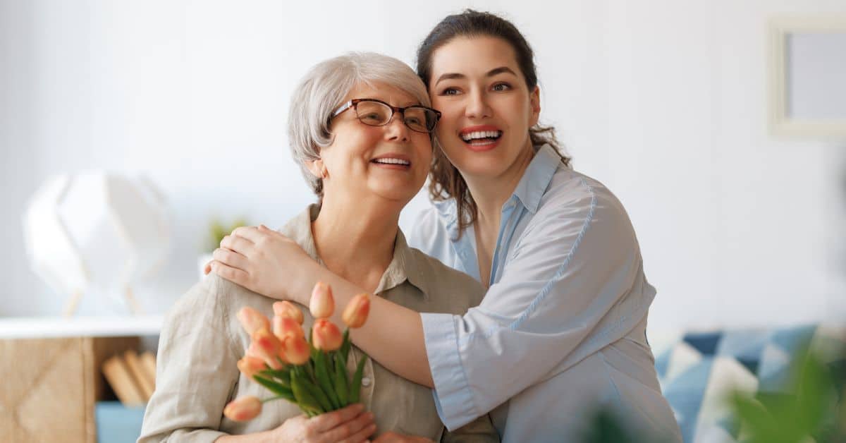 Why Parents Fear Moving To Senior Living And How To Help 1 Daughter Hugging Her Mother In Senior Living Community