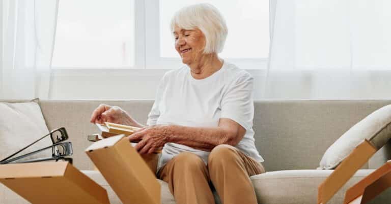 senior-woman-packing-her-things-to-move-into-senior-living